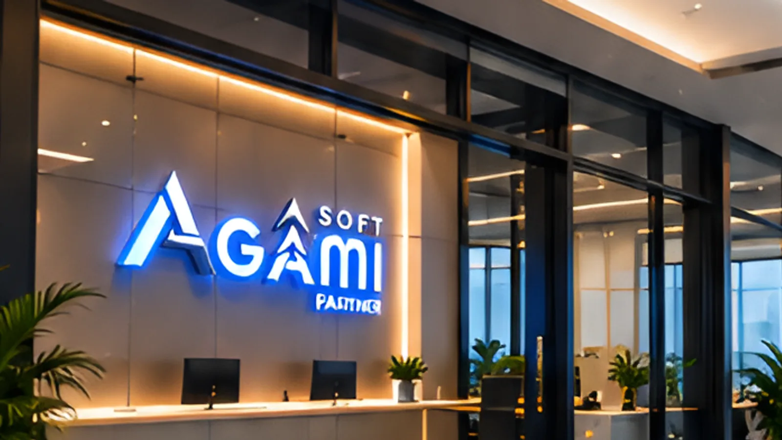 The Agami Soft studio at night, with the illuminated AGAMI company mark mounted on the wall